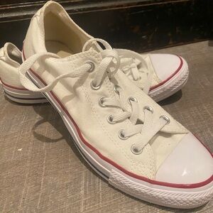 White Converse Canvas Sneakers with Red and blue Trim.